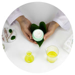 A Cosmetic Chemist in a laboratory working with natural preservatives for skincare formulations